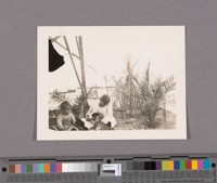 The only park in the first days of Brawley was a 6 by 6 feet corner next to Mr. Miller'[sic]tent residence.A few feet away were the two brick makers' renada[sic].The two little girls were Mr. Miller's daughters. This was the only tent in the town that had a shake roof. Part of the frame supporting it is here shown
