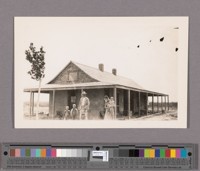 Pete Hoverly and family and their new adobe house, being the first one built in Brawley