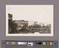 After the fire. The bank walls and the heard[sic] store in the background. This shows the commotion soon after the fire in the rear of the building