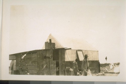 The Hoverly family and their tent house just before they built their adobe residence