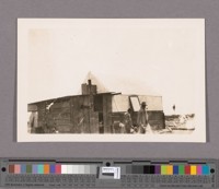 The Hoverly family and their tent house just before they built their adobe residence