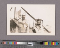 Mr. F.S. Miller and his daughter Margaret eating the first watermellon[sic] grown in Brawley. They are waiting for dinner to