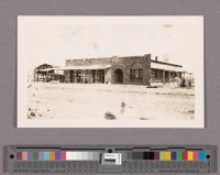 The bank building in process of construction. Also the new Heard store, next door. Mr. Miller built and owned the bank, the "First National of Brawley". Mr. Heard owned the store, this being his second move in two months. He moved into larger quarters three times within four months so rapidly did the town grow
