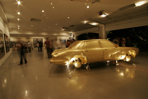 The Jewel / In God We Trust: junk car covered in gold leaf at the haudenschild Garage: auction night