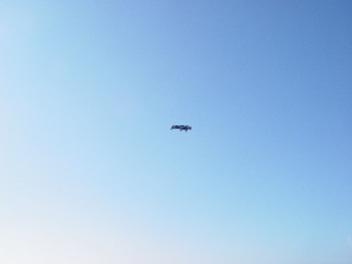 One Flew Over the Void (Bala perdida): human cannonball David Smith mid-flight as he is shot from a cannon and across border fence