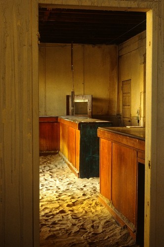 Crossroads/BAGGAGE BUILDING: general view with sand covered floor