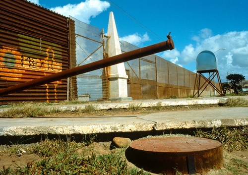 International Waters: detail of pipe from Mexican side of the border fence