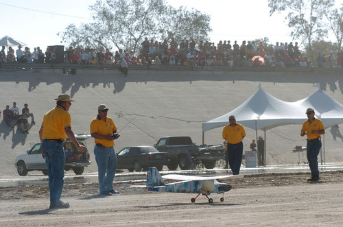 Aerial Bridge: model planes and pilots with spectators