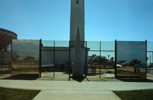 Picturing Paradise: Border fence with mirrored surfaces: view from the United States side of border