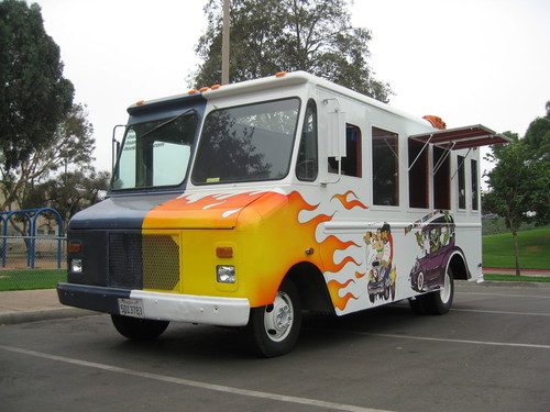 Some Kindly Monster: left side of truck with custom painted exterior: flames