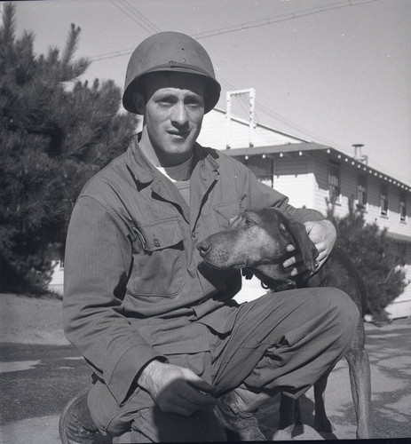 Trainee with a dog at Fort Ord