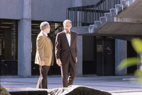 University President Ellis McCune in front of the University Library