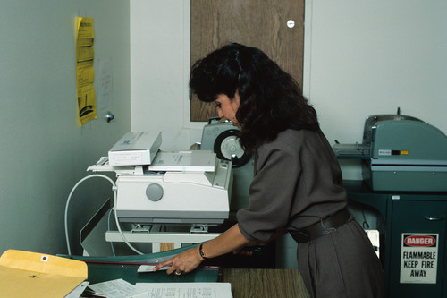 Woman cutting paper