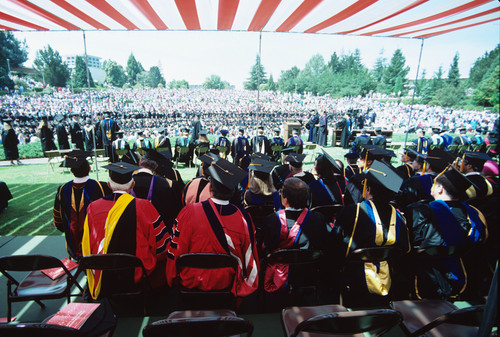 Slide of graduation ceremony taken from behind the faculty