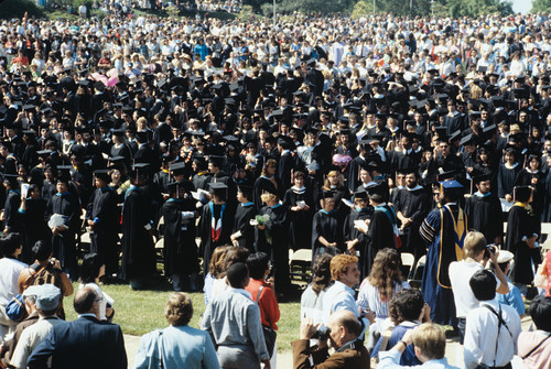 Slide of a crowd of graduates