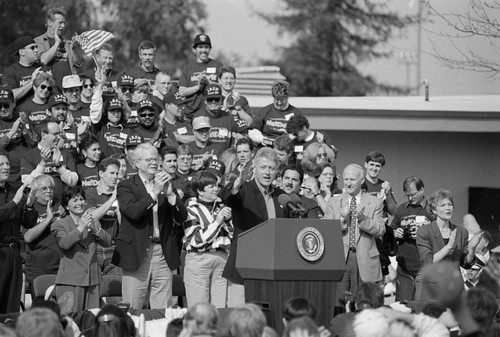 President Bill Clinton speaking with arm raised at California State University, East Bay