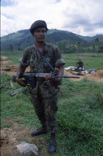 Contra soldier holds firearm, Honduras, 1983