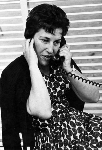 Mrs. Gladys Bazell waits to talk to her son, Frank, by overseas telephone