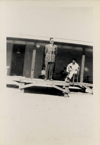 Dallas McLaren on stage at school building at Poston Relocation Center