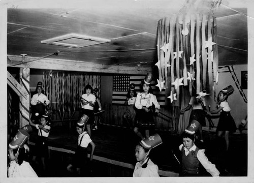 Baton twirling and dancing during patriotic presentation at Jerome Relocation Center