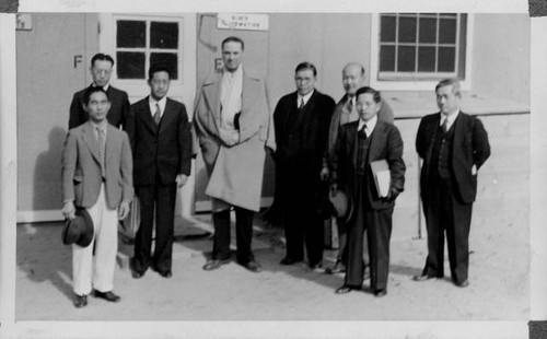 Group of men outside building at Granada Relocation Center