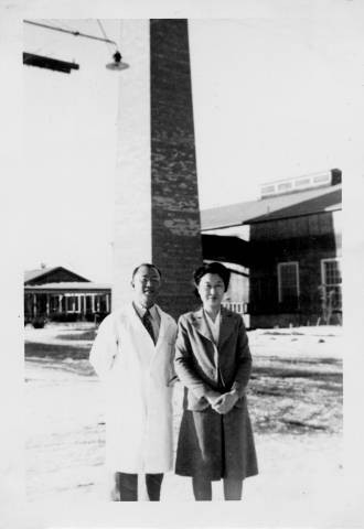 Dr. Taro Akamatsu and wife, Yasuka Akamatsu, outside in the snow at Tule Lake relocation center