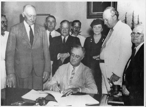 Franklin D. Roosevelt signing the Social Security Bill