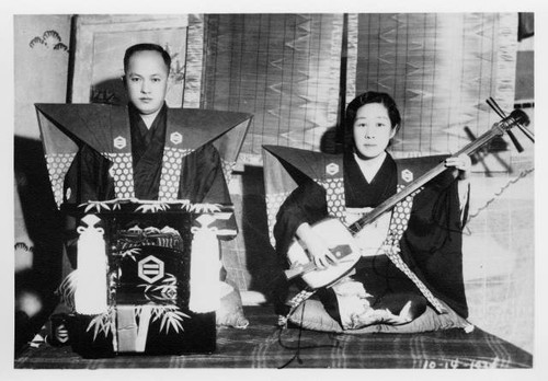 Mr. and Mrs. F. K. Nakamura of Seattle with musical instruments at Kabuki play