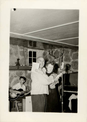 Martin and Margaret Gunderson standing in front of microphone