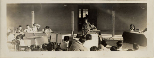 Young man on stage at school at Posten Relocation Center