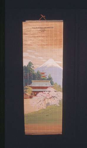 Grace and Joe's Beauty and Barber Shop promotional mat wall hanging with painting of Mt. Fuji