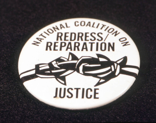 Pin worn for support of Japanese American redress/reparation