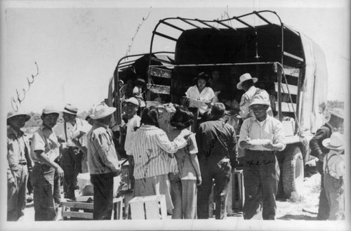 People gathered around truck