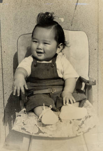 Baby in chair at Granada Relocation Center