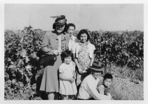 Takehara family in front of grape vineyard