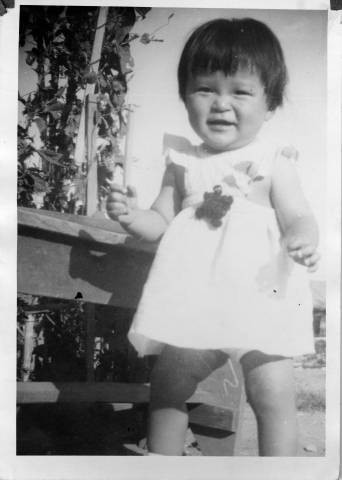 Small child in sundress at Granada Relocation Center