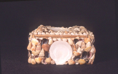 Pressboard box covered with shells