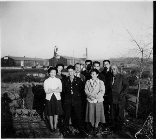 Japanese Americans standing outside barracks at Tule Lake Relocation Center [?]