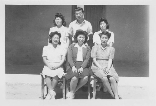 George Higashioka and five women outside building at Poston Relocation Center