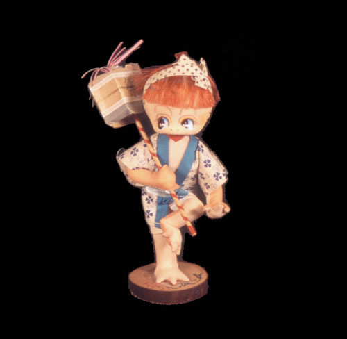 Kappa doll holding box on stick