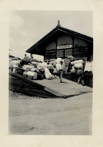 Japanese Americans pile luggage at the Elk Grove train station