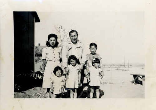 Matsuda family outside barracks at Granada Relocation Center