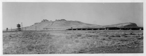 Panoramic photo of Tule Lake Relocation Center barracks, watchtowers and Castle Rock Mountain