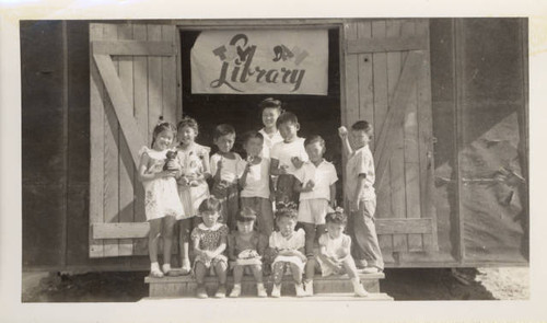 Elementary students in front of toy library at Poston II Relocation Center