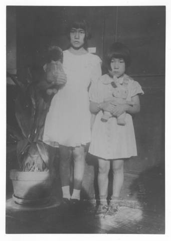 Mariko Nagumo and Reiko Nagumo holding stuffed animals