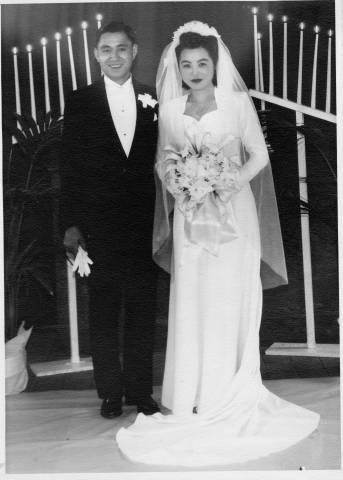 Wedding portrait of Miss Kiyo Aiura and Mr. Oliver K. Noji at Tule Lake Relocation Center