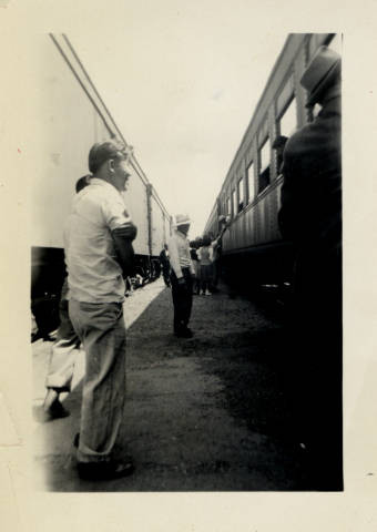 Nisei[?] boy says goodbye to friends leaving by train to the relocation centers