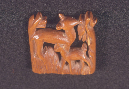 Wood carving of deer and fawn