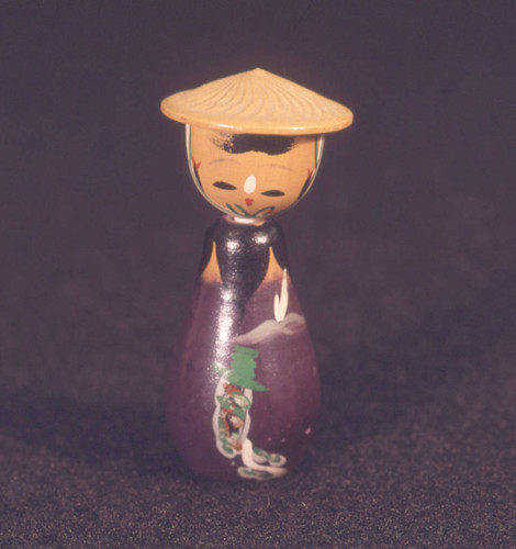 Kokeshi doll with eggplant shaped body