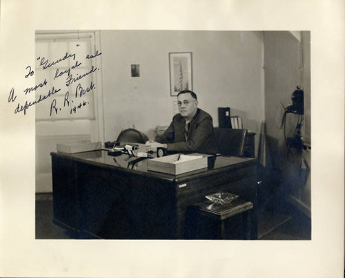 Ray Best seated at desk